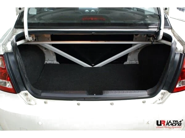 Rozpórka tylna górna (Rear Upper Strut Bar) (1158) Ultra Racing Proton Saga Blm (BT / MK1) 1.3/1.6 2WD 08-16