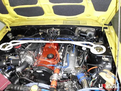 Rozpórka przednia (Front Upper Strut Bar)Ultra Racing Mitsubishi Lancer A174 79-87